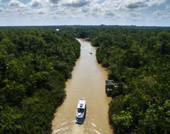 A picture of a boat going down the Amazon River