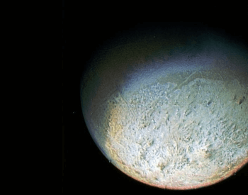 A detailed surface photo of Neptune's moon Triton.