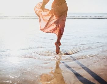 A picture of a woman walking in saltwater