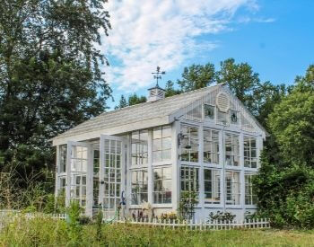 A picture of a backyard greenhouse