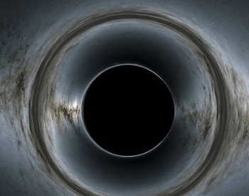 A simulated photo of a black hole warping space and light