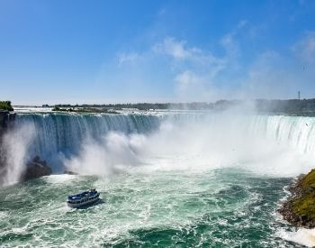 A picture of a boat near Niagara Falls waterfall