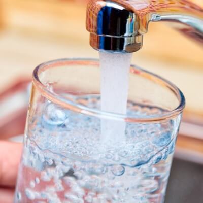 A picture of tap water and a glass