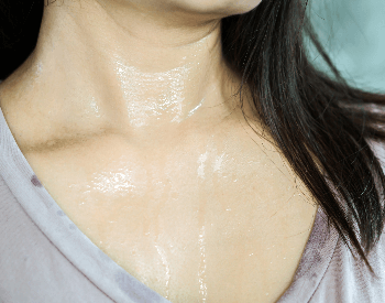 A picture of a woman sweating from the heat