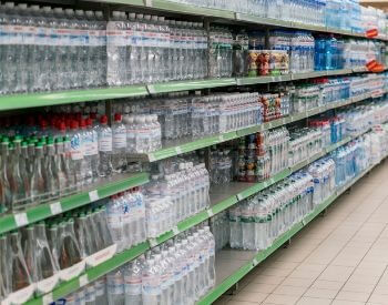 A picture of water bottles sold in a grocery store