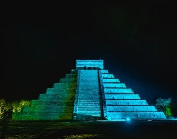 A picture of Chichen Itza during the nighttime