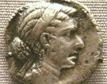 A picture of Cleopatra's face on a silver coin