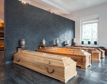 A picture of some coffins in a funderal home