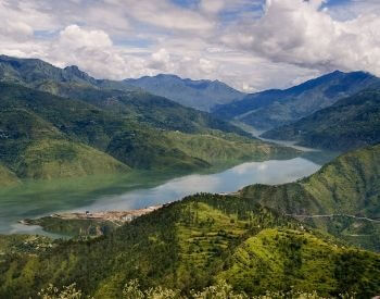 A picture of the Ganges River and mountains in the background