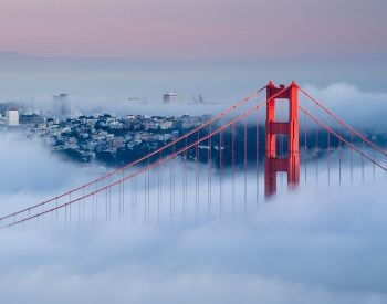 A picture of the Golden Gate Bridge on a very foggy day