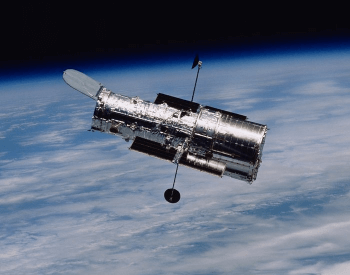 A photo of the NASA Hubble Space Telescope in above Earth in orbit