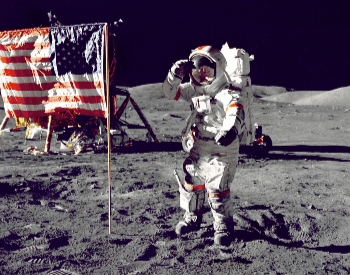 A photo of Neil Armstrong by the American Flag on the surface of the moon