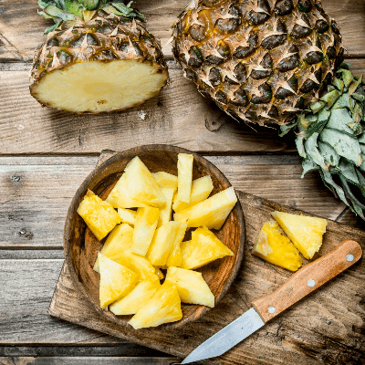 A Picture of a Pineapple and Cut Pineapple