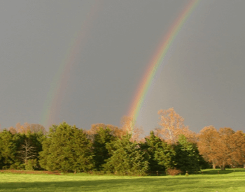 A picture of a primary and secondary rainbow