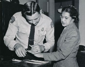 A picture of Rosa Parks being fingerprinted in 1956