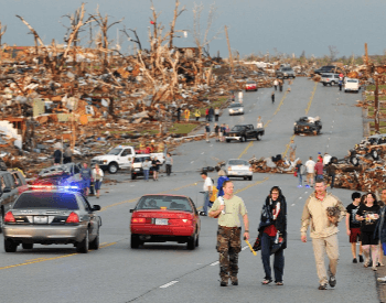 Survivors walking among destroyed homes after the 2011 Joplin Tornado