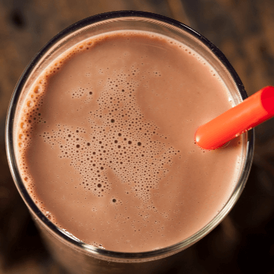 A Picture of the Top of a Glass of Chocolate Milk