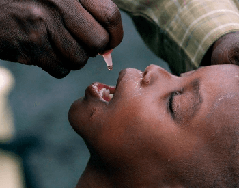 A vaccine being administered via the mouth