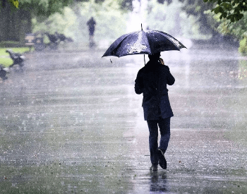 Walking in the rain with a umbrella
