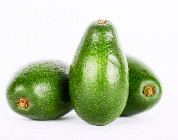 A picture of a few whole avocados