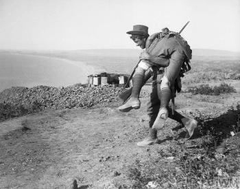 A picture of a WW1 troop carrying a wounded solider at the Battle of Gallipoli